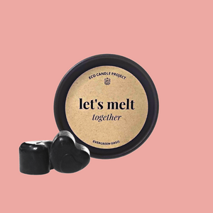 melts in heart shape in a black round kraft box